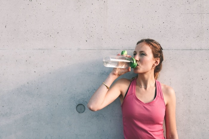 Fit woman hydrating