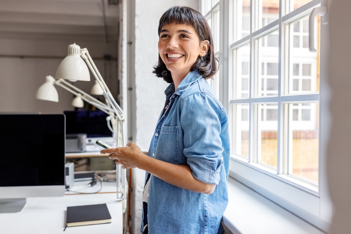 Lady in a blue shirt happy that she’s purchased 408 visa health insurance