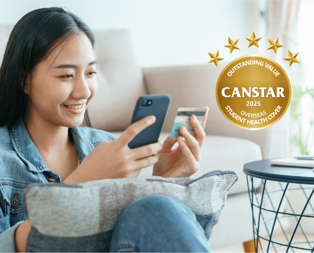 A lady checking her mobile about Canstar award