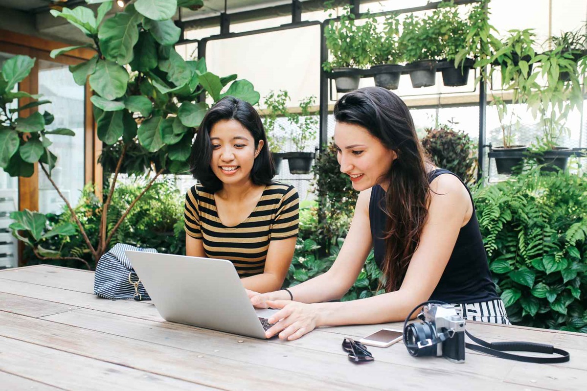 A man checking his phone about Canstar award