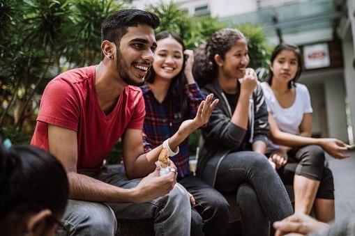 Overseas students sitting and chatting